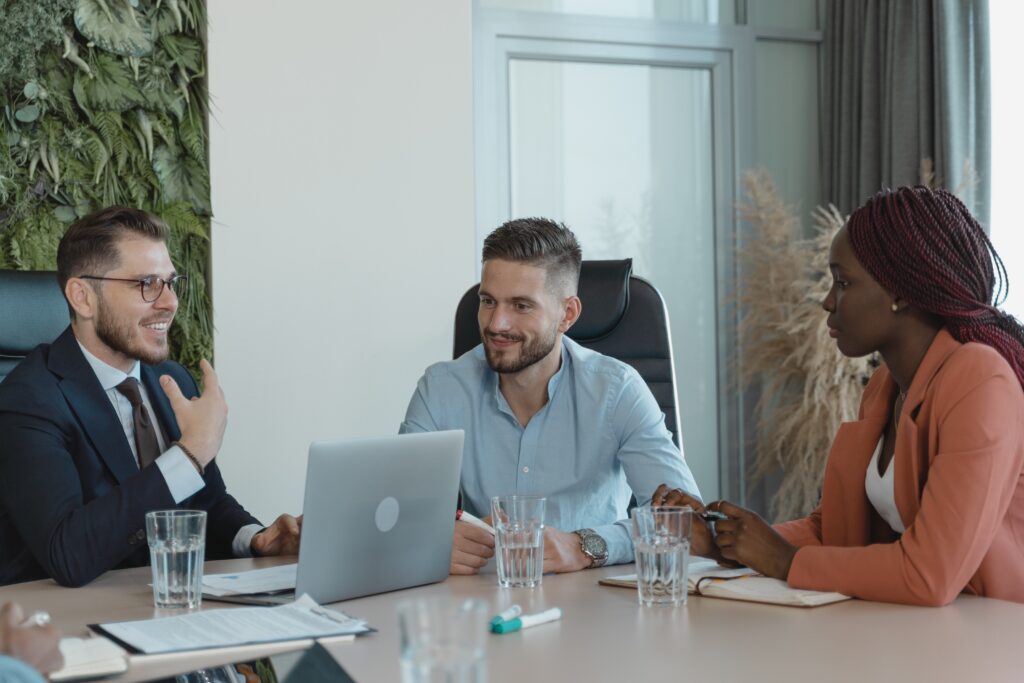 Three people in a meeting room